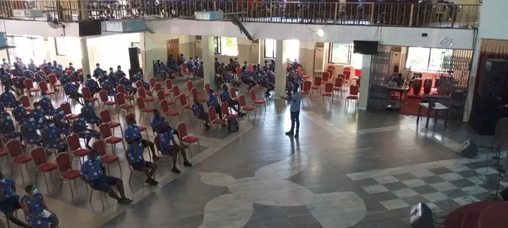 Forces Senior High Technical School students seated in a large hall, listening to a speaker at the STEM careers session